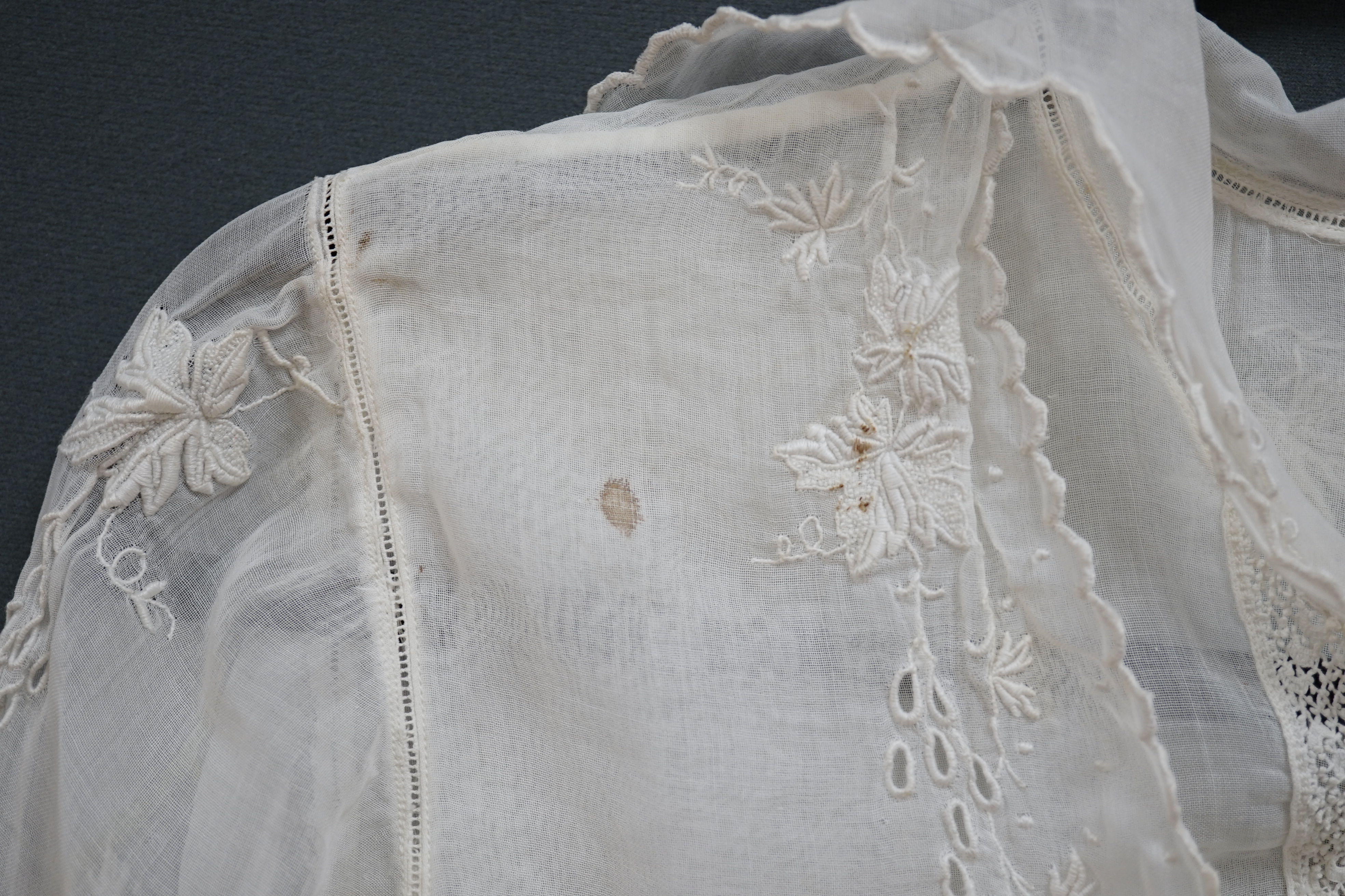 An early Edwardian fine lawn ladies hand made and embroidered crochet dress, embroidered with a white worked skirt, cuffs and lower waist and Irish crochet bodice insertions, with novelty detailing of a faux jacket front